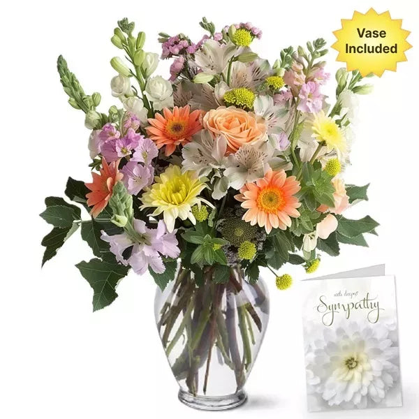 A colorful bouquet with a &#39;With deepest Sympathy&#39; card, vase included.