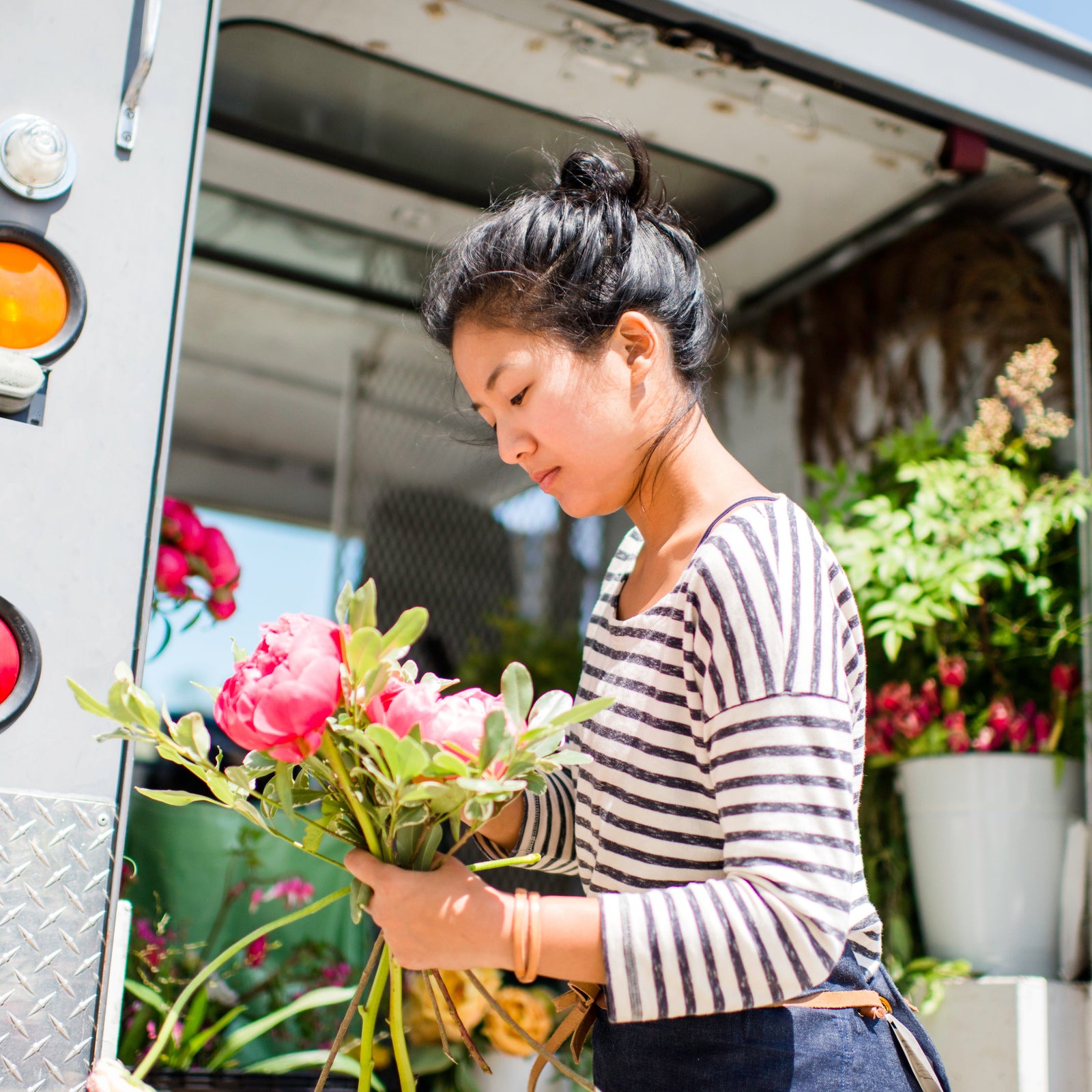 Florist holding flowers, October 2024